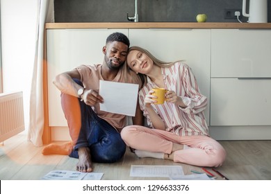 Interracial Young Couple Of Entepreneurs Sharing Ideas About New Small Business Project, Working At Home With Documents, Planning New Marketing Concept, Small Or Family Business Collaboration Concept