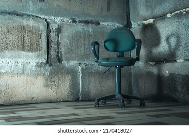 The Interrogation Chair. An Old Chair In A Concrete Basement.