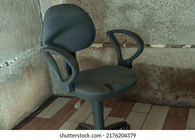 The Interrogation Chair. An Old Chair In A Concrete Basement.