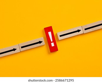 Interruption of the process. System error or failure. Red wooden block with an exclamation mark is stopping the process on a yellow background.