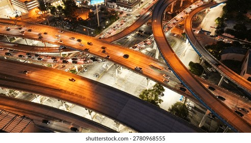 Intersecting elevated highways with vehicles generating light trails during evening rush hour