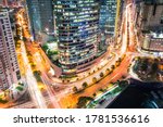 Intersection of Buendia and Ayala Avenue at night, during rush hour. Cityscape of Makati, Metro Manila, Philippines. Heart of Financial District.