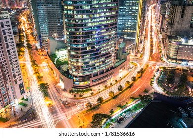 Intersection of Buendia and Ayala Avenue at night, during rush hour. Cityscape of Makati, Metro Manila, Philippines. Heart of Financial District.