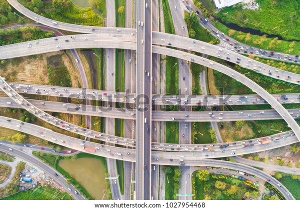 Intersection cross road with vehicle movement\
aerial view by drone, City\
transport