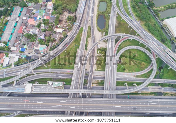 Intersection cross traffic city road with vehicle\
transport aerial\
view