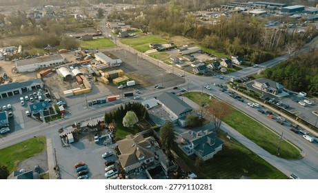 Intersection landuse mix captures homes, industrial yards commercial buildings meeting at White Marsh corridor with wooded buffers extending toward Perry Hall edge, Maryland. USA