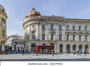 The intersection of roads between Strada Smardan and Strada Lipscani in the historic center of Bucharest, Romania, on a sunny day