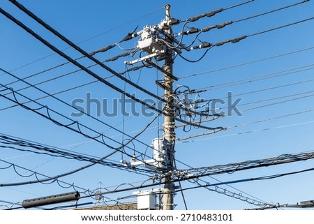 Intersection of utility pole and power lines