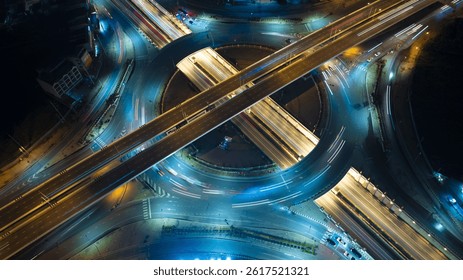 Intersection view above , Expressway top view, Road traffic an important infrastructure, car traffic transportation above intersection road in city night of advanced innovation, financial technology