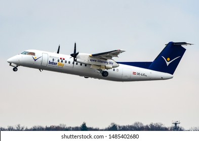 InterSky Bombardier DHC-8-314Q Dash 8. Registration: OE-LIC, Manufacturer Serial Number: 503, Taking Off From The Runaway At The Berlin Tegel Airport. Berlin, Germany March 2, 2013.