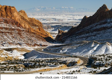 Interstate 70 winds it's way through snow covered Spotted Wolf Canyon through the San Rafael Reef in Utah in Winter