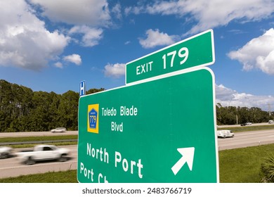 Interstate freeway exit sign in Florida, USA. I-75 highway interchange with direction to North Port and Port Charlotte