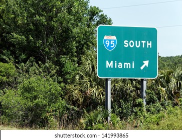 An Interstate Sign Points The Way To Miami, Florida.