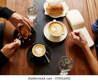 Interview In A Cafe With Coffee And Pastry