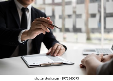 Interview employee talking about resume and job description with job applicants sitting in front in the office, Job applications concepts. - Shutterstock ID 1973540093