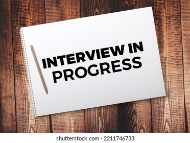 Interview In Progress Memo Written On A Notebook With Pencil