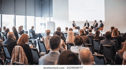 Interview and round table discussion at business convention and presentation. Audience at the conference hall. Business and entrepreneurship symposium. - Powered by Shutterstock