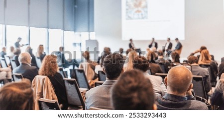 Interview and round table discussion at business convention and presentation. Audience at the conference hall. Business and entrepreneurship symposium.