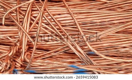 Interwoven copper wires showcasing complex twists and reflective textures.