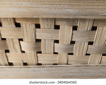 Interwoven strips of thin bamboo.