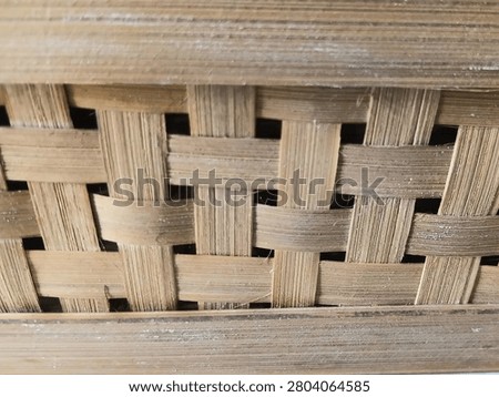 Interwoven strips of thin bamboo.
