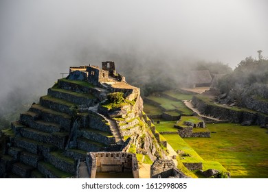 Intihuatana pyramid in a mist with ritual stone on Machu Picchu archeological site, Cusco, Peru, South America