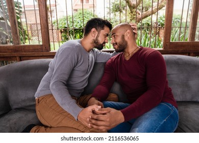 Intimate Gay Couple Enjoying The Company Of Each Other In The Couch