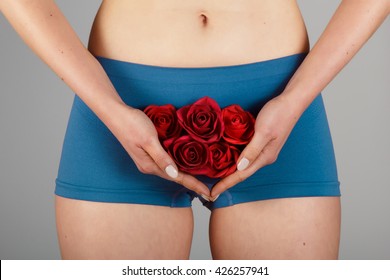 Intimate Part Of A Woman's Body With Roses