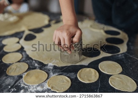 Intimate scene capturing baker precisely crafting pastry on floured surface