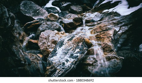 Up Into The Mountain, Surrounded By Rocks And Natural Fresh Water Is Coming Out Of The Massive Mountain, Could Be Used As Background Decoration Or Wallpaper 