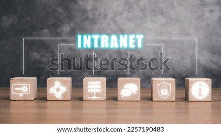 Intranet concept, Wooden block cube on desk with intranet icon on virtual screen.