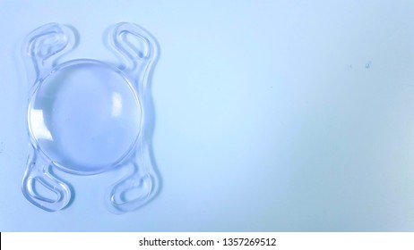 Intraocular Lens On Blue Background