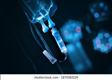 Intravenous drip with solution bag in a dark room. - Shutterstock ID 1879583239