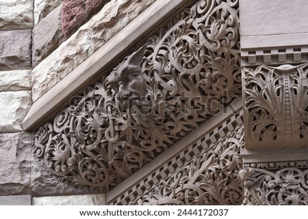 Intricacy of a corner decoration. Colonial architectural feature or detail in Old City Hall Building (1898), Toronto, Canada