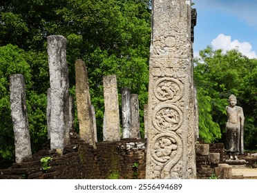 Intricate carvings on stone pillars at the ancient Atadage Shrine in Polonnaruwa, Sri Lanka, a UNESCO World Heritage site. The serene Buddha statue in the background adds spiritual significance - Powered by Shutterstock