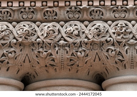 Intricate decoration of column capitals. Colonial architectural feature or detail in Old City Hall Building (1898), Toronto, Canada