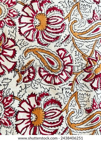 Intricate floral and paisley block printed fabric on cotton fabric