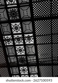 Intricate Geometric Ceiling Patterns in Black and White