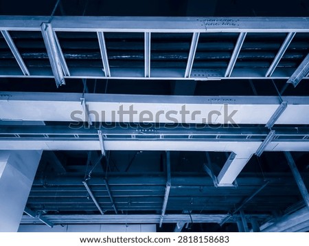 Intricate Overhead Structures: A Harmonious Blend of Industrial Design and Functionality  