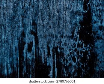 Intricate pattern on the texture of weathered tree bark, featuring a mix of colors and lines.