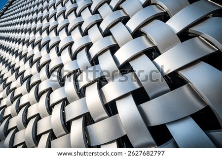 Intricate Patterns of Light and Shadow in Modern Metal Weaving Design  