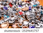 Intricate silver and copper jewelry charms ideal for handmade accessories, personalization, and crafting. Perfect for vintage jewelry enthusiasts and creative DIY projects.