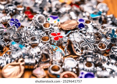 Intricate silver and copper jewelry charms ideal for handmade accessories, personalization, and crafting. Perfect for vintage jewelry enthusiasts and creative DIY projects.