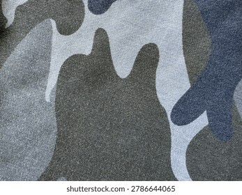 Intricate textile surface showcasing a harmonious fusion of muted grey, dark green
