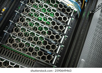 An intricate view of server racks in a data center, showcasing powerful hardware with vibrant green LED lights. This image highlights modern technology and infrastructure. - Powered by Shutterstock - Get 15% off with code: PIKWIZARD15