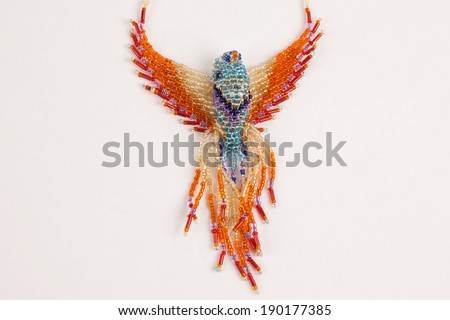 Intricately beaded fashion jewelry colorful exotic bird