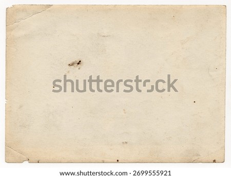 An intriguing texture of old paper, soiled and damaged, as well as darkened by time and use, on a white background. Unique vintage texture of old paper which is approximately 60-70 years old.