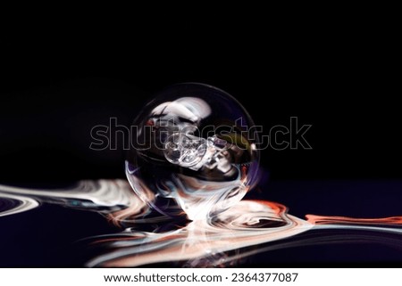 An intriguing white light emanating from a light bulb in a dimly lit setting creating a mysterious aesthetic