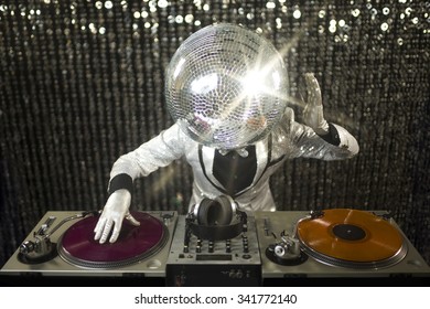 introducing mr discoball. a cool club character DJing in a club