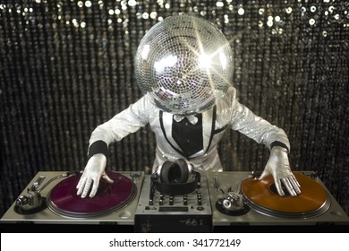 introducing mr discoball. a cool club character DJing in a club